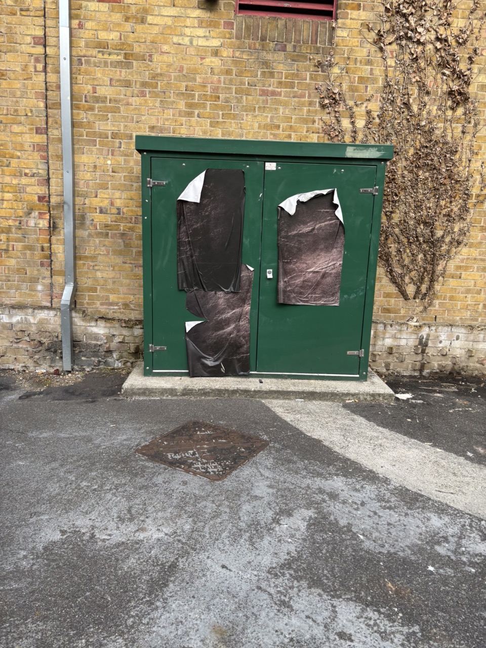 Paste ups on a telephone junction box